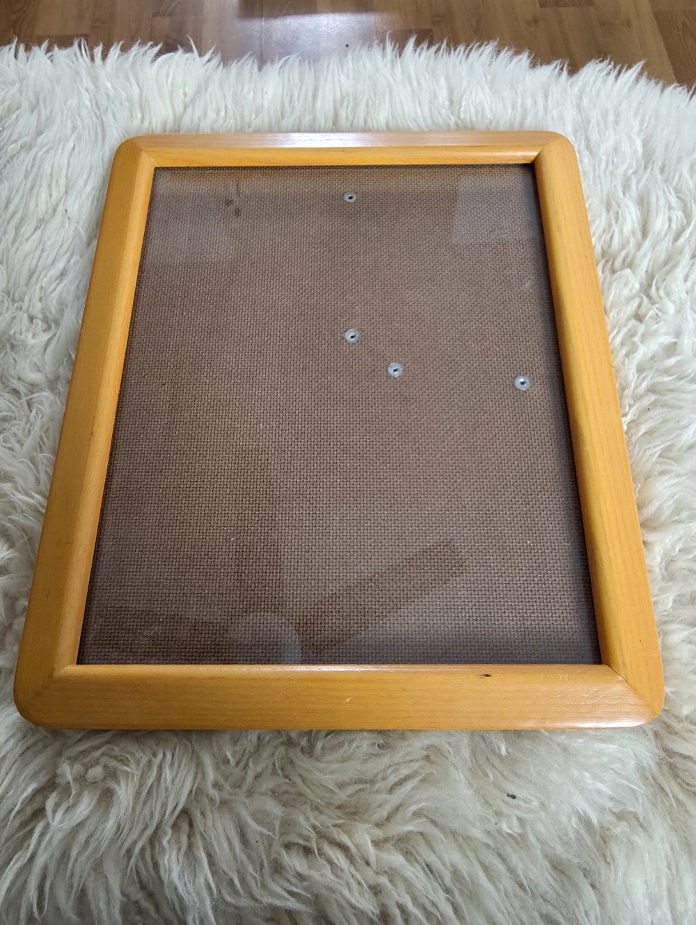 Vintage wooden picture frame featuring rounded corners